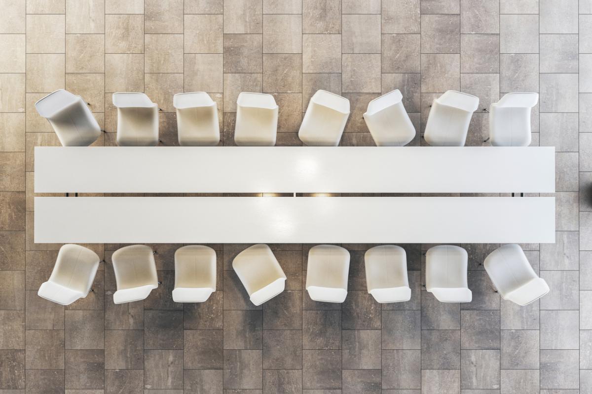 Modern conference room with white table and chairs
